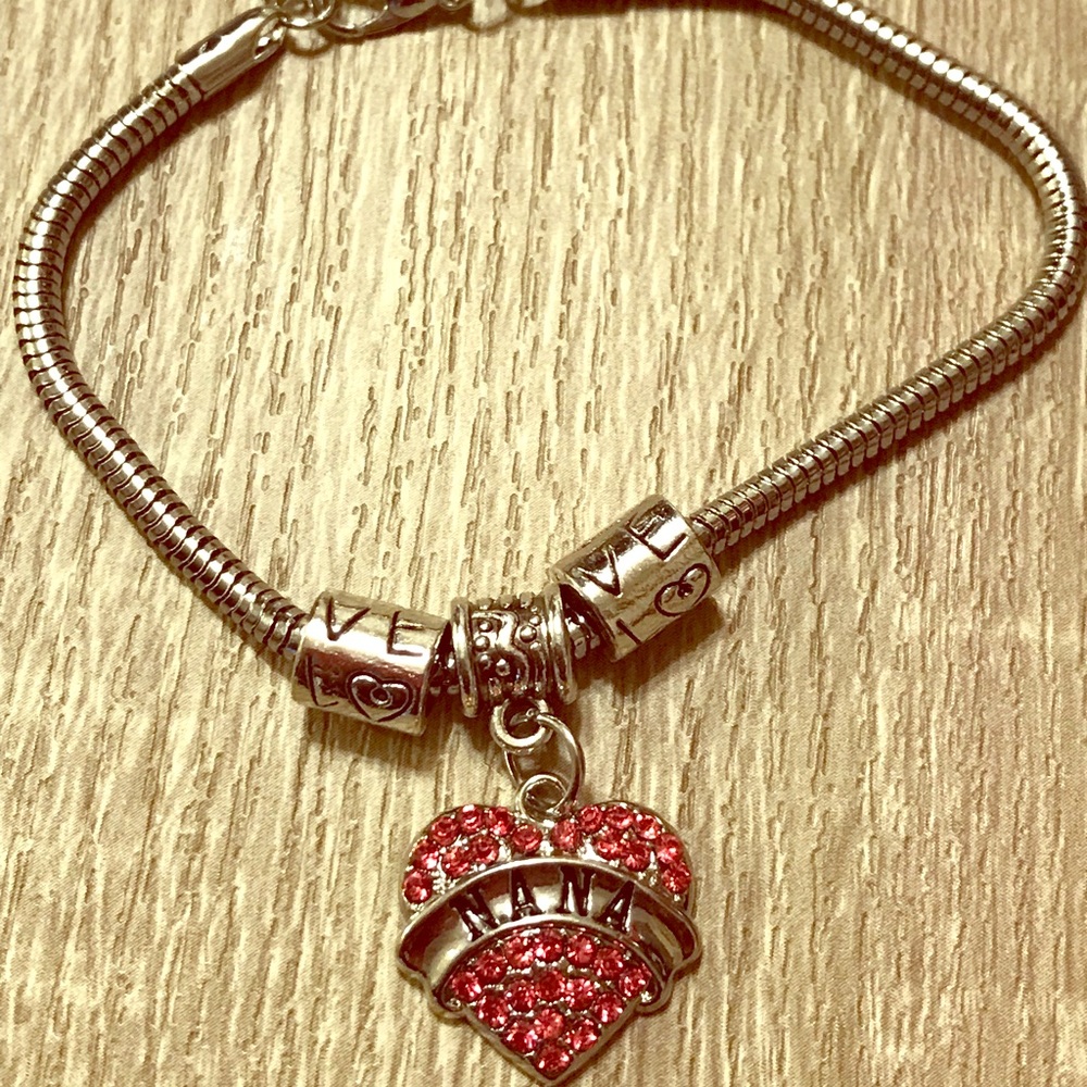 9.25 SS  Fashion Bracelet w/Heart shape charm.